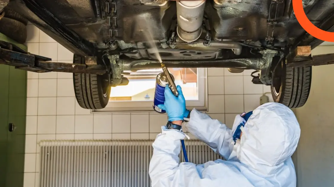 spraying sealant under the car